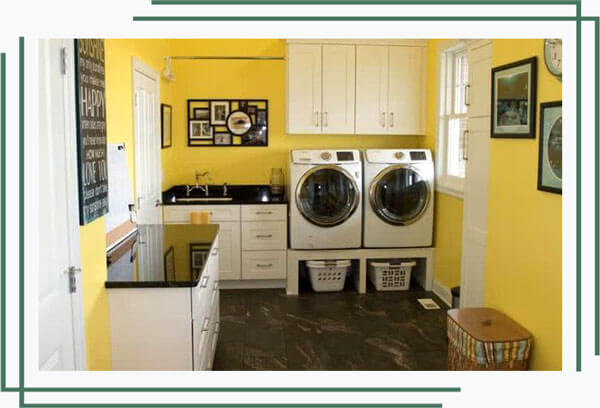 Newly remodeled laundry room with cabinets, storage, and countertops
